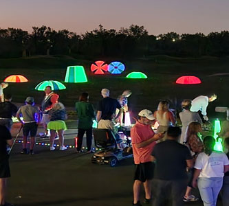 Night Golf cosmic driving range, interactive targets